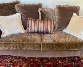 Stunning Living Room with a (never sat in) Sofa by Huntington House, 2 Armless Occasional Chairs with scrolled top in Tan Microsuede, Exceptional Wall Art by Rena and Sotskova, Beautiful Custom Rug , Carved Mahogany Lamp Table with Table Lamp and Floor Torchiere Lamp.  Highlight piece is the Seven Seas Credenza by Hooker with 2 Buffet Style Lamps.