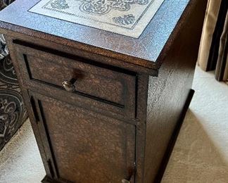 Closer look at the side table with 1 drawer and cabinet.