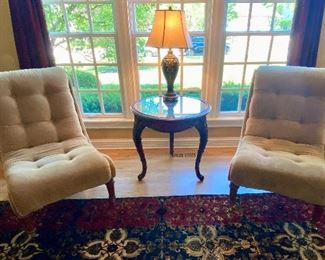 Pair of Tan Armless with Scrolled Top Occasional Chairs and Mirror-top Carved Mahogany Lamp Table and Table Lamp.