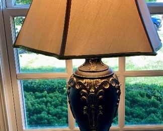 Pair of Tan Armless with Scrolled Top Occasional Chairs and Mirror-top Carved Mahogany Lamp Table and Table Lamp.