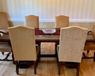 The Dining Room Table and 8 Chairs.  The Dining Room Table was Custom Made from Honquest Furniture in Barrington, IL.  2 Captain Chairs and 6 Dining chairs with Leather Seats.    The Table is absolutely Beautiful with double pedestal legs.