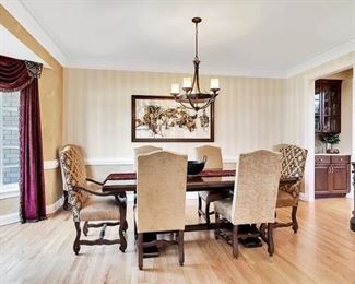 The Dining Room Table and 8 Chairs.  The Dining Room Table was Custom Made from Honquest Furniture in Barrington, IL.  2 Captain Chairs and 6 Dining chairs with Leather Seats.    The Table is absolutely Beautiful with double pedestal legs.