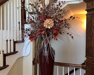 Floral Arrangement in the Foyer on top of Glass Table with Wrought Iron Base and Marble Insert.