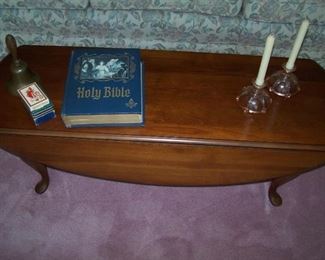 BIBLE, DEPRESSION CANDLE HOLDERS, BRASS BELL ON QUEEN ANNE-STYLE COFFEE TABLE