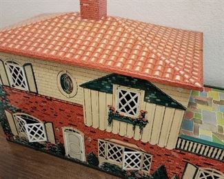 Old Metal Dollhouse in great condition. Comes with box of furniture