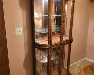 $225, Tall Rounded glass Curio w/lights