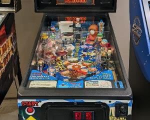 Sega South Park Pinball Machine. The whole gang is here in this hilarious and entertaining pinball game. There is some light paint wear that can be seen in the photos and the ball release is malfunctioning. The client is having it repaired and will be in working order for the pickup. All other lights, flippers and functions seem to be in working order. As of 6/26 a new spring and general maintenance has been performed. 

Edited 6/29 a new back board was installed when old battery corrosion was discovered during maintenance. After the install, several areas are not communicating and further diagnostic would have to be performed. The earliest a repair technician could come is several weeks after the auction closes and this item is being sold as is!!