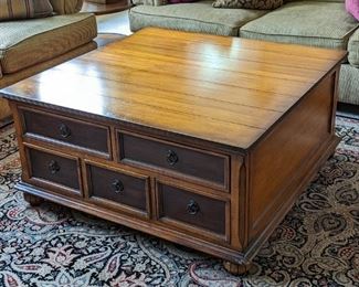 Large Tommy Bahama Lexington Coffee Table. There are some light scratches/marks on the top and damage to one lower leg that can be seen in the photos. Measures 41.5” x 41.5” and 20” high