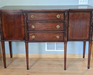 Beautiful Henredon Sideboard/Buffet. An elegant piece that is in excellent condition and would pair nicely with the dining room set in the next lot! Measures 60" wide, 21" deep and 40" high
