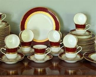 Noritake Hemingway Dish Set. A beautiful swirled red pattern with gold rims! All look to be in excellent condition and includes service for twelve. The dinner plates measure close to 11” in diameter.