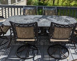Metal Patio Set by Agio. There is some paint wear on the tabletop that can be seen in the photos but could easily be repainted. The table measures 41" x 83" and 29" high