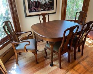 BUY IT NOW $ 700 Michigan black walnut Queen Anne style dining table and 5 chairs (2 w/arms); french silk jacquard seat fabric. Comes with 2 leaves. Table dimensions: 47" x 53" x 29". Chair dimensions: 22" x 19" x 40".
