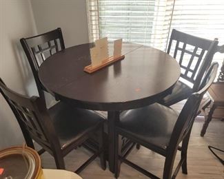 High top dining table with leaves and 6 chairs