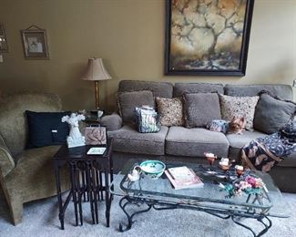 Sofa with matching pillows  $200. Set of glass sofa table, 2 end tables and coffee tables  $300.