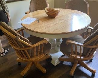 a very nice oak and white kitchen table and chairs