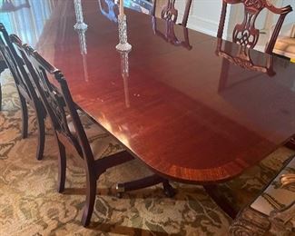 Banded mahogany double pedestal table and 8 chairs- 2 painted, 6 matching table color
