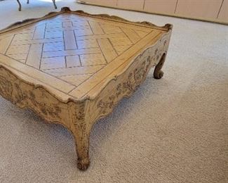 LARGE CARVED COCKTAIL TABLE
