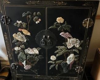 Pretty asian-inspired lacquer cabinet w/2 shelves. Raised floral design