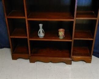 Mid-Century wood book shelf with various Roseville and  Hull art pottery 