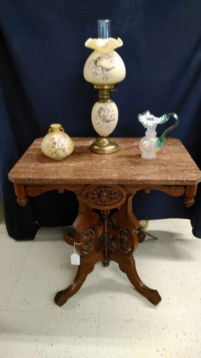Victorian marble top table with a signed Fenton GWTW Lamp and vast, hand painted porcelain vase