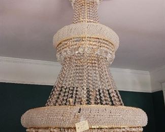 Lot 27     4 ft Tall Crystyal Chandlier  price 5000  buyer responsible for electrician removal 