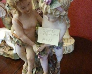 Lot 142    Bisque Cupid Figure      30    as is