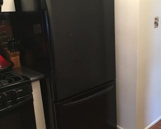 Amana refrigerator with bottom freezer.