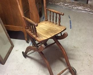 Antique rolling high chair