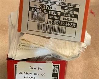 2 Boxes Stuffed Full of White and Beige Tablecloths and Cloth Napkins