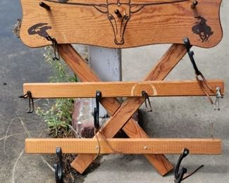 Western themed wall hanging with hooks