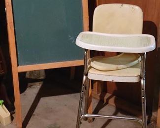 Vintage high chair and children's chalk board 