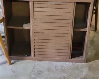 Small bookcase with sliding door 