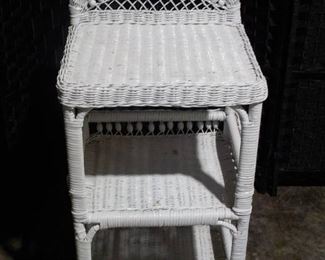 Nice White Wicker Shelving Unit with Wooden Bead Design at Top