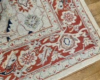 Traditional wool area rug.
