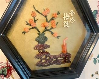 Japanese sculpture art in shadowbox frame.
