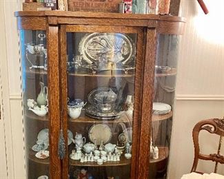 Antique curved front china cabinet.