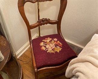 Victorian balloon back chair with needlework seat.