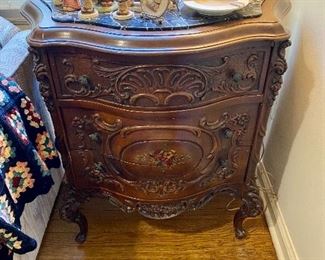 Beautiful carved end table/chest with marble top.