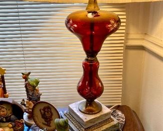 Antique ruby red lamp on marble base.