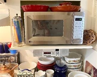 LG microwave & counter full of casserole dishes.