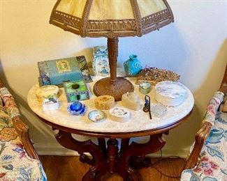 Victorian marble top table and antique slag glass lamp.