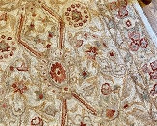 2 matching wool area rugs.