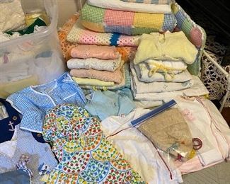 Vintage baby clothes. blankets and toys.