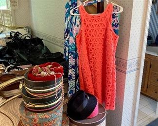 Lily Pulitzer dresses, hanging on a antique oak coat stand.