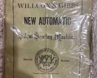 Early 1900's Willcox & Gibbs pedal sewing machine & table.