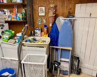 Laundry room with lots of household supplies.