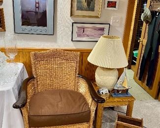 Wicker armchair, side table & reading lamp.