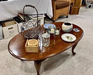 Oval wood coffee table.