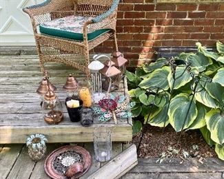 Back deck garden decor & wicker armchair.