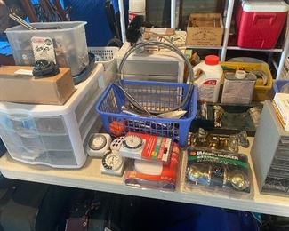 Garage full of tools & necessary household supplies.